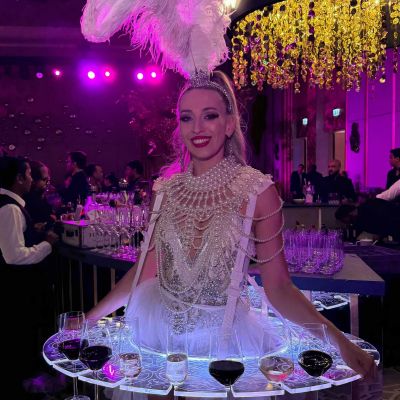 led tray girl dubai white dress wine drinks